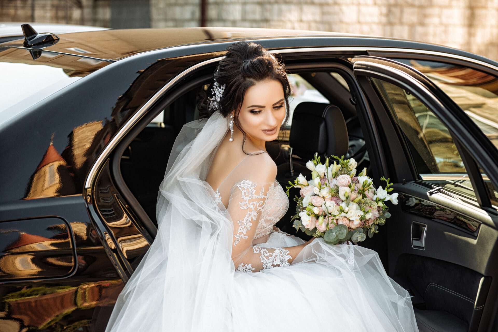 Dark-haired,Bride,Jewelry,Head,Sits,In,A,Black,Car,On